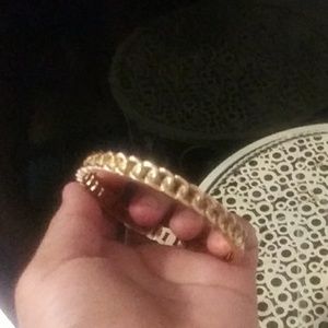 A beautiful gold bracelet fits almost every size